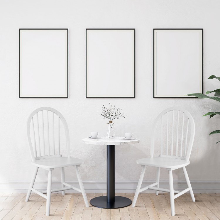 Set of 2 white vintage Windsor wood chairs with spindle back, perfect for dining room use and easy maintenance.